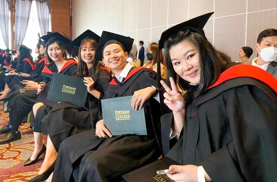 PORTMAN College graduates celebrating together