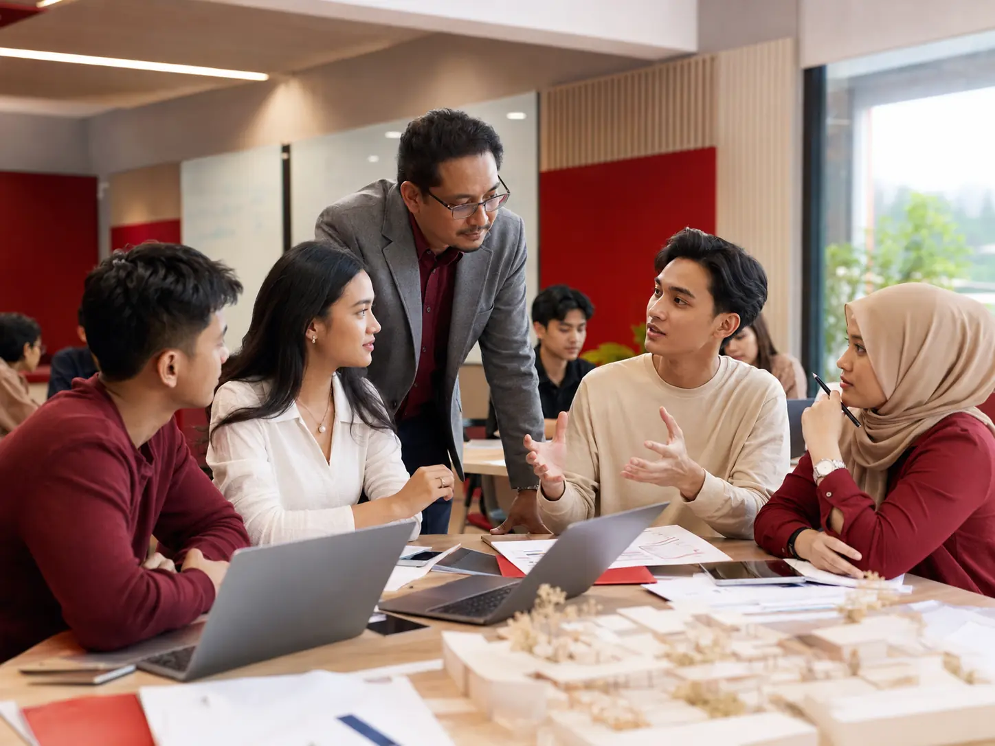 College students discussing a business project in a modern learning space